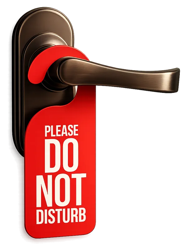 Traditional Do Not Disturb sign on a hotel door handle